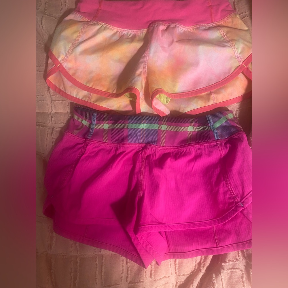 2 size 8 ivvia shorts. Orange and pink. No stains or flaws. Never been worn.